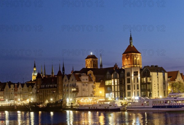 The harbour district on the Motlawa river, Motlawa, in the city centre of Gdansk, illuminated in