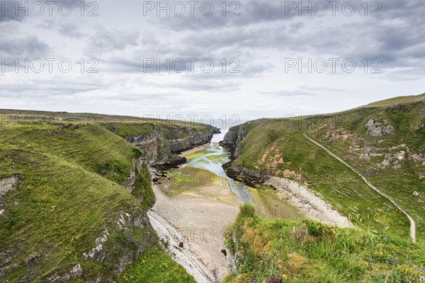 View from the viewpoint above Smoo Cave into the almost 800m long fjord Geodha Smoo, Durness,