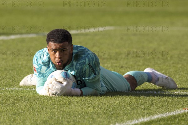 Football match, Noah ATUBOLU SC Freiburg safely holds the ball lying on the ground, Voith-Arena