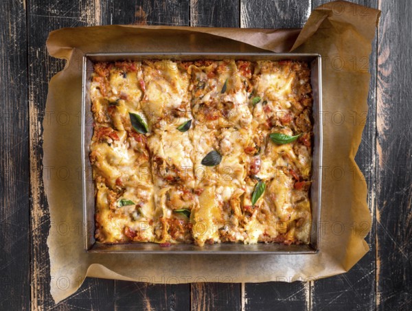Top view of a delicious traditional italian lasagna made with minced beef bolognese sauce topped
