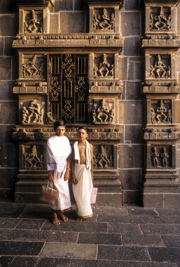 Dikshitar boys in front of karna sculptures in Thillai Nataraja temple in Chidambaram, Tamil Nadu,