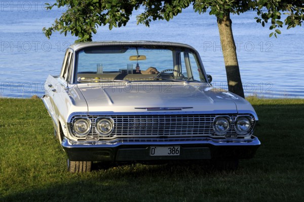 American classic car, Chevrolet Bel Air from 1963, behind the lake Glafsfjorden, Arvika, Värmland,