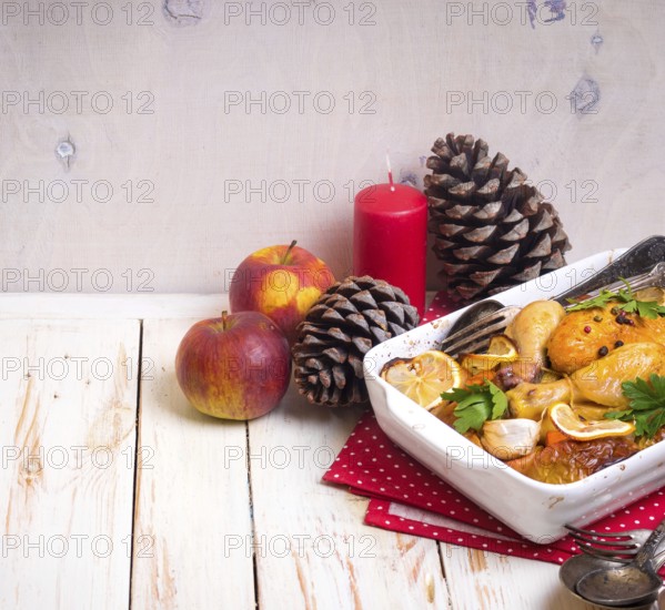 Roasted chicken. Christmas food. Celebration white wooden table with roasted chicken, apples,