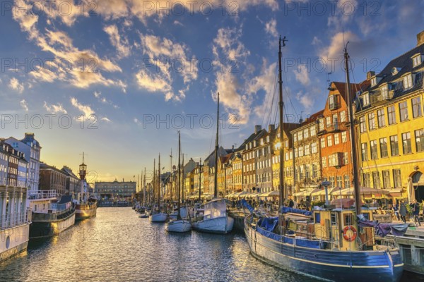 Copenhagen Denmark, sunset city skyline at Nyhavn harbour with colourful house