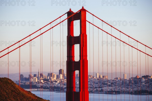 A view at dusk thru the Golden Gate Bridge towards downtown San Francisco. In California, USA,
