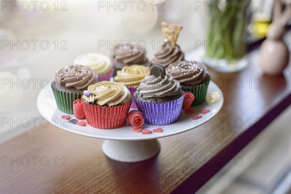 Eight deliciously sweet cupcakes covered with creamed chocolate, vanilla and various other
