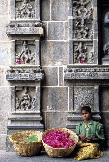 A girl selling flowers passageway of east gopuram in Thillai Nataraja temple in Chidambaram, Tamil