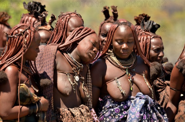 Mourning Himba women at a funeral, the widow in the middle, Omohanja, Kaokoland, Kunene, Namibia,