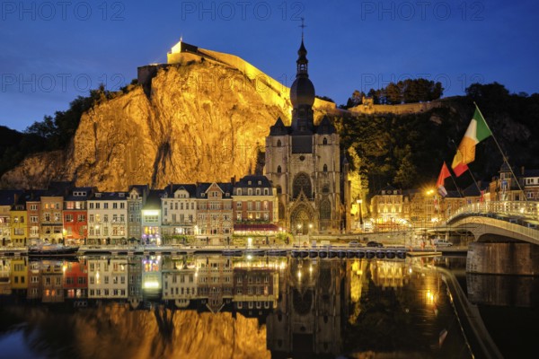 Night view of Dinant town, Collegiate Church of Notre Dame de Dinant over River Meuse and Pont