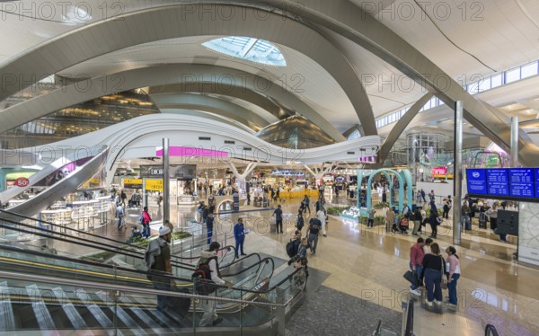 Abu Dhabi Airport, Zayed International Airport with passengers. Duty free shop. The new Terminal A