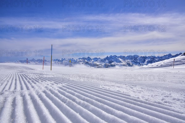 Ski slope in the ski area Hoher Ifen in Kleinwalstertal, in the foreground tracks of a snow