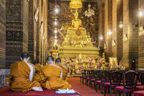 Wat Pho temple in Bangkok near the Grand Palace. Buddhist monks during a religious ceremony.