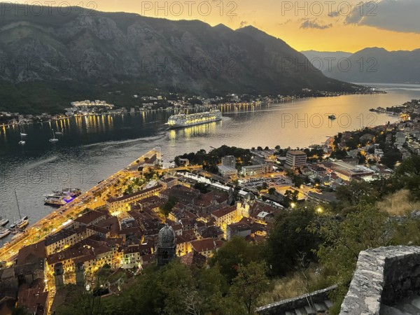 Evening atmosphere, sunset, view of the old town of Kotor from above, Bay of Kotor, cruise ship,