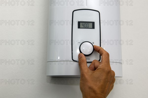 Instantaneous water heater for hot water shower washbasin bidet is set at temperature of 40 degrees