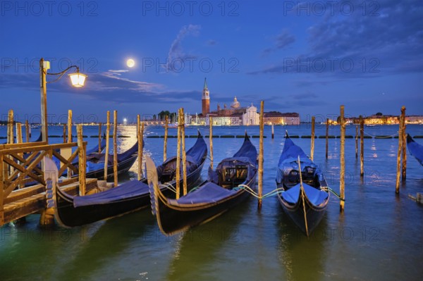Romantic vacation Venice travel background, gondolas at Saint Mark (San Marco) square and Basilica