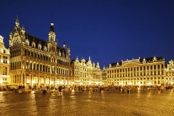 BRUSSELS, BELGIUM, MAY 31, 2018: Grote Markt (Grand Place) square crowded with tourists illuminated