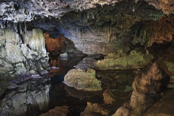 Neptune cave, stalactite cave with lake, colourful rocks, bizarre landscape, Sardinia, Italy,