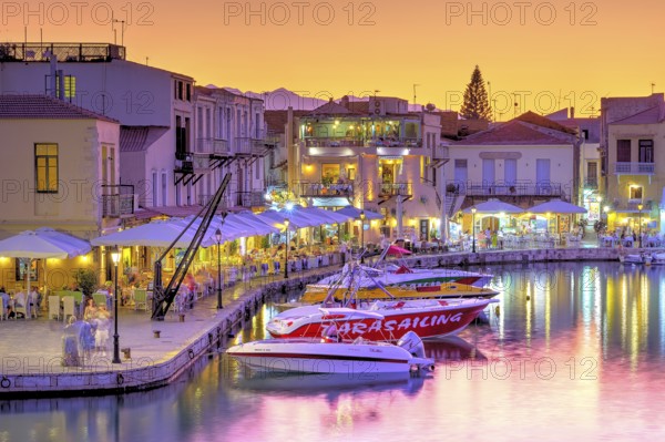 Venetian harbour, dusk, night shots, orange sky, colourful rows of houses, water reflection,