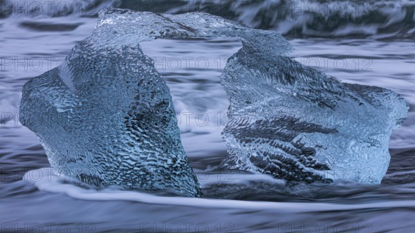 Artfully shaped iceberg on the black beach of Breidamerkursandur, near Jökullsarlon, Sudurland,
