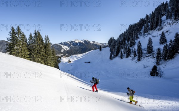 Two ski tourers in a wintry mountain landscape, ascent to Roßkopf, Mangfallgebirge, Bavaria,