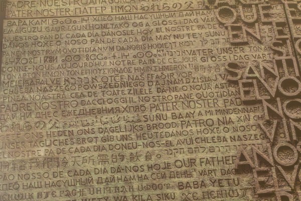 Lord's prayer written in many different languages, creating a spiritual and multicultural tapestry