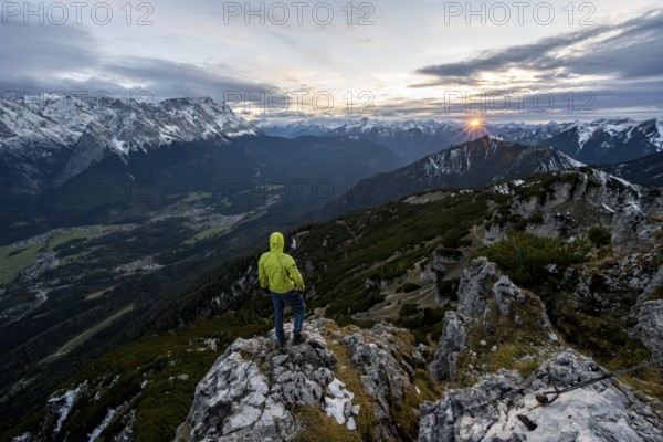 View Mountain panorama with Wetterstein mountains and Zugspitze, at sunset with sun star,