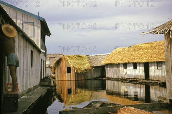 Informal housing built on logs, known as the floating city, Manaus, Brazil 1962, which was removed