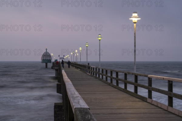 Illuminated Vineta Bridge, pier with diving gondola, blue hour, Zinnowitz, Usedom Island, Baltic