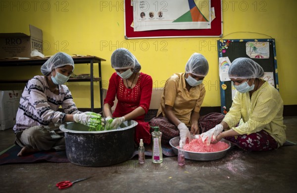 Students of Ashaneer Home makes organic coloured powder ahead of Holi Festival, in Guwahati, India