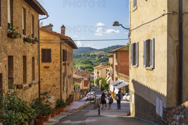 Street with views of the surrounding hills, San Gimignano, Tuscany, Province of Siena, Italy,