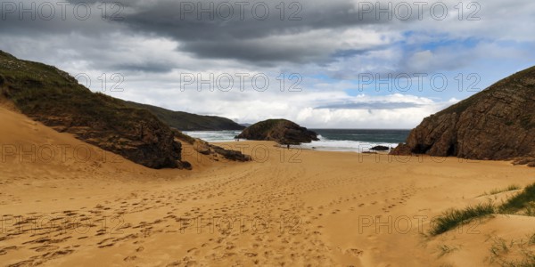 Cliff on sandy beach, bay, Boyeeght Beach, Murder Hole Beach, rain clouds, Sheephaven Bay, Rosguill