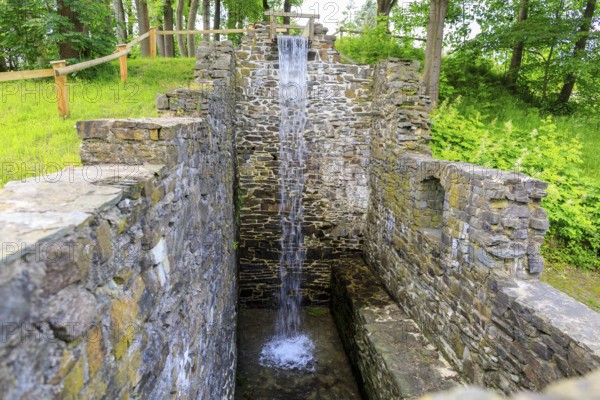 Ruins of the Sendig mill with wheel chamber and waterfall, oldest paper mill, Zwönitz, Erzgebirge,
