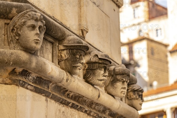 Famous heads on the façade of the Cathedral of St James, UNESCO World Heritage Site in Sibenik,