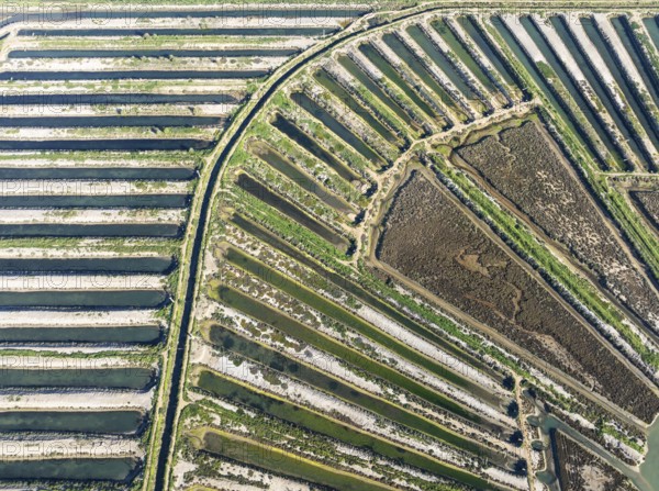 Saline ponds at the salt works of Isla Cristina. Aerial view. Drone shot. Huelva province,