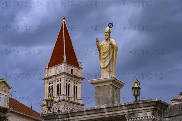 Statue of the patron saint Ivan Ursini on the city gate and the tower of the Cathedral of St