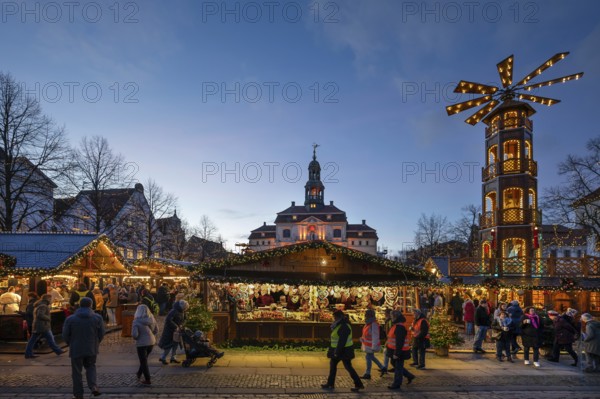 Large Christmas pyramid at the Christmas market at dusk, behind the town hall, Lüneburg, Lower