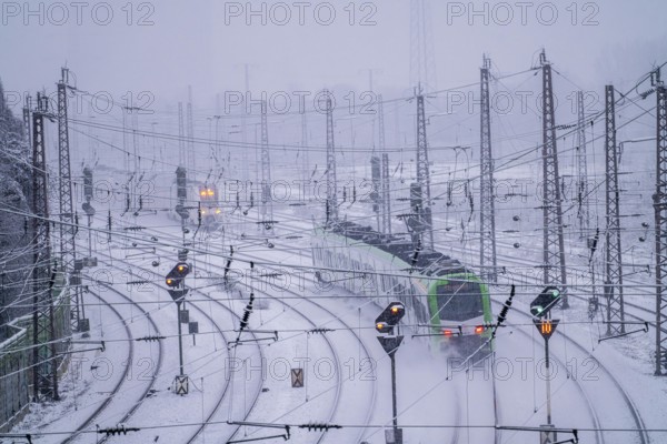 Winter weather, heavy snowfall, railway tracks in front of Essen main station, S-Bahn train, North