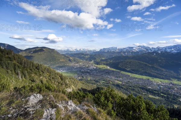 View of Garmisch-Partenkirchen and mountain panorama, hike to Kramerspitz, in autumn, Ammergau