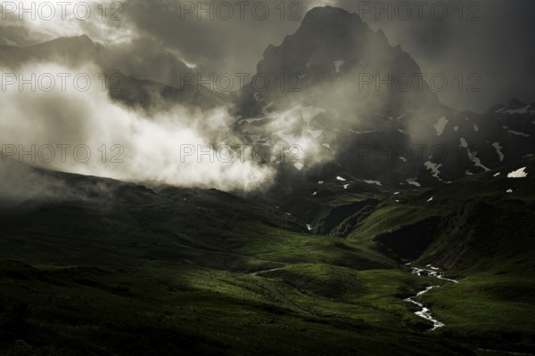 Peaks in the morning light and alpine landscape with dramatic clouds, Lech, Lechquellengebirge,