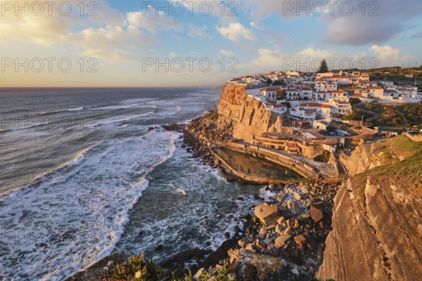 Scenic view of the seaside Azenhas do Mar fishing village on cliff on Atlantic ocean coast,