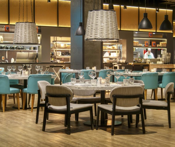 Tables and chairs set for diners in Gino D'acampo restaurant, Melia INNSiDE Liverpool hotel,