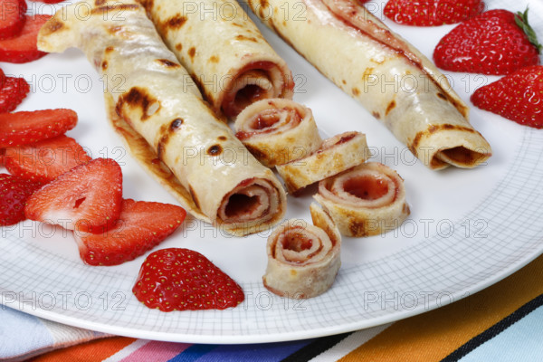 Swabian cuisine, filled pancakes, Flädle with strawberry jam, Gsälz, fresh strawberries, sweet,