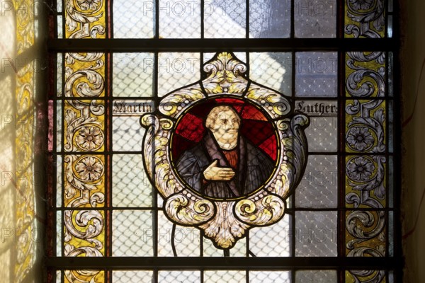 Stained glass window with Martin Luther in the Evangelical Lutheran Market Church of St Cosmas and
