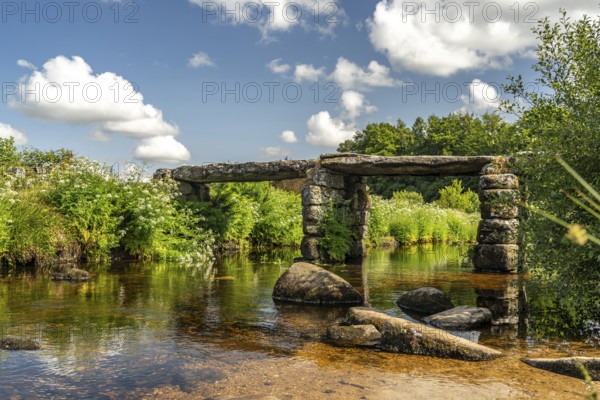 The medieval stone slab bridge Clapper Bridge in Postbridge, Dartmoor, Devon, England, Great