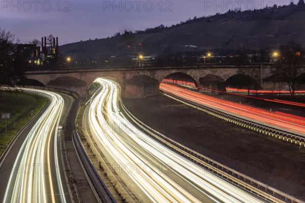 Multi-lane road at night with Plinsau bridge, arch bridge over the Neckar. Federal road B10 in