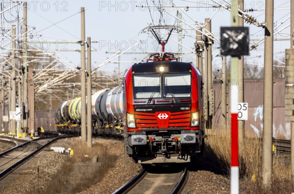 Goods train with Swiss locomotive passing through Baden-Baden station on the Rhine Valley line. SBB