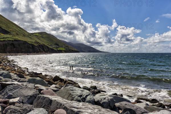Coastline, rocky coast, Rossbeigh beach on the Atlantic coast, spring clouds, panoramic road Ring