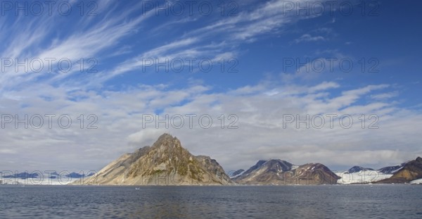 Luciapynten, mountain with steep sea cliffs in Hornsund fjord in summer, Svalbard, Spitsbergen,