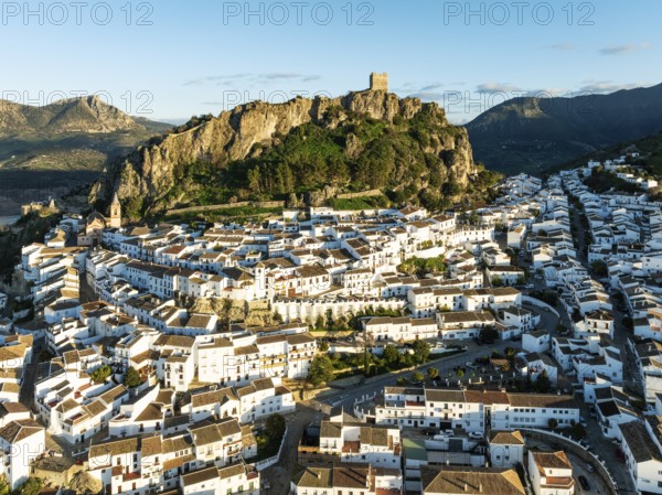 The White Town of Zahara de la Sierra below a Moorish castle. Aerial view. Drone shot. Cádiz
