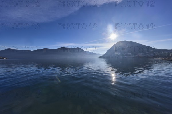 Lake, hills, haze, fog, backlight, blue sky with veil clouds, Lake Lugano, Lugano, Lugano district,